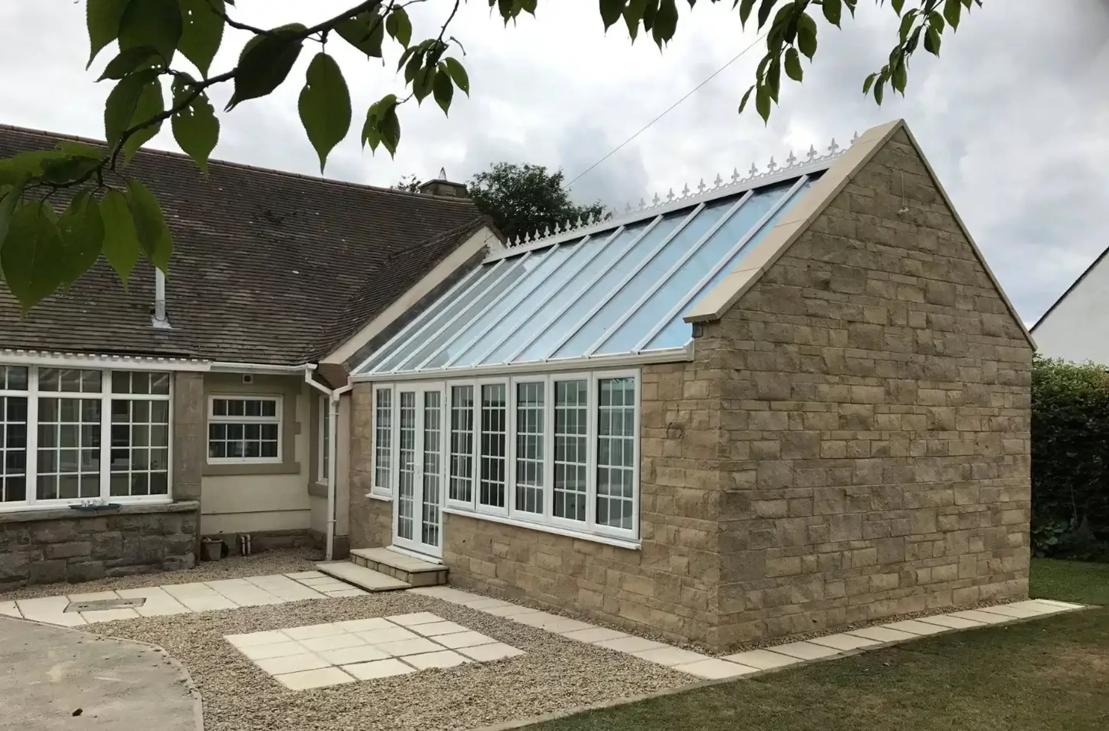 Large stone orangery extension onto existing property 